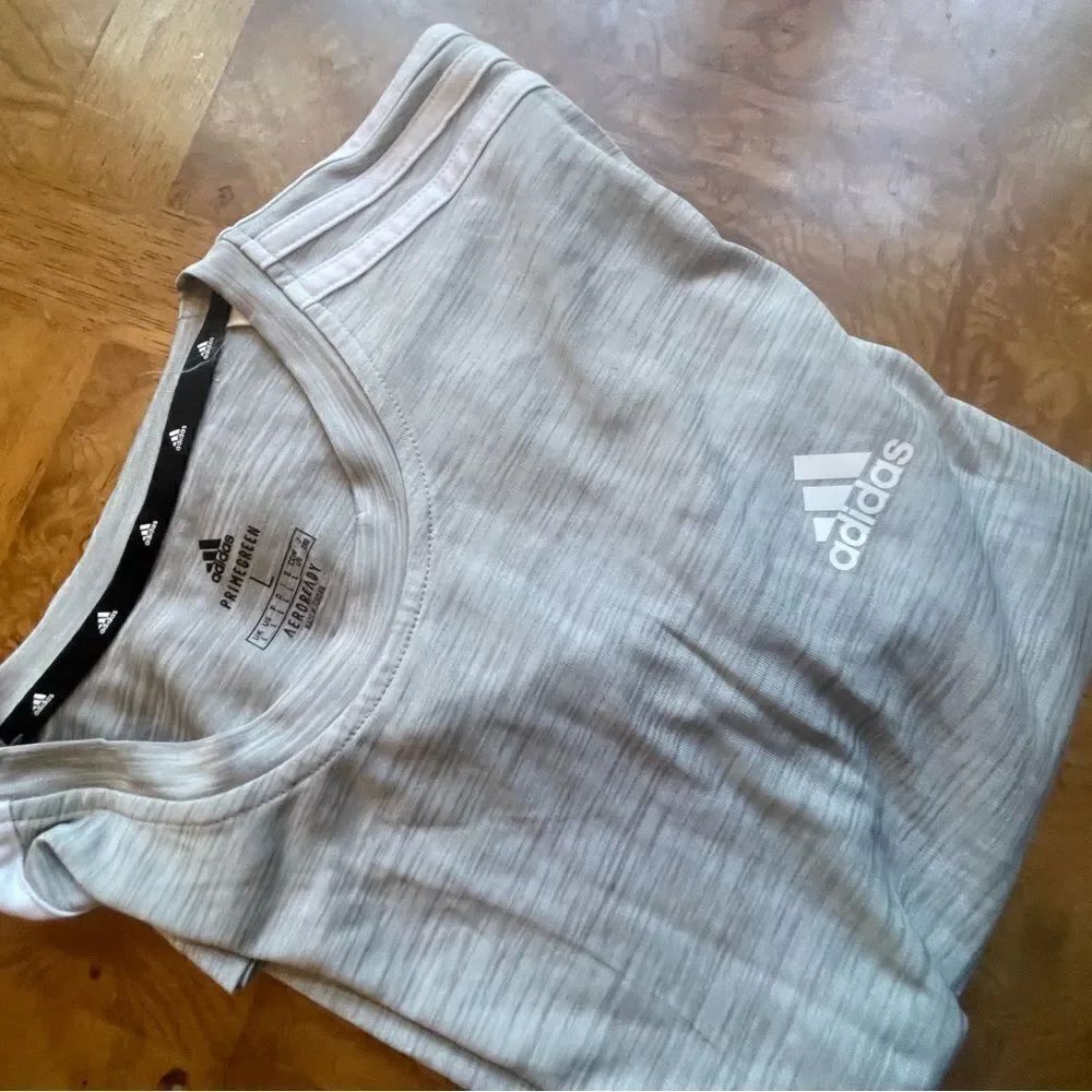 Adidas L Men’s Gray T Shirt with White Sporty Stripes!